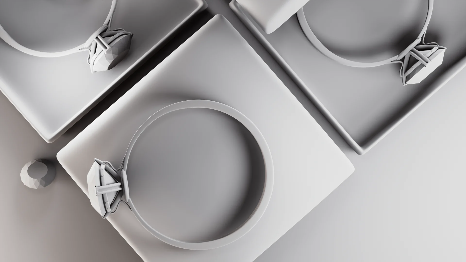 clay-render-diamond-rings-jewelry-boxes.webp Grey clay render of diamond rings arranged on square jewelry boxes showing 3D model structure