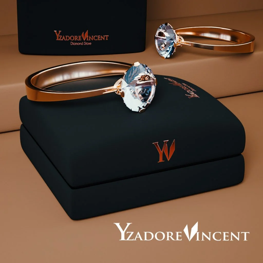 diamond-rings-on-jewelry-box Two rose gold diamond rings resting side by side on a black jewelry presentation box