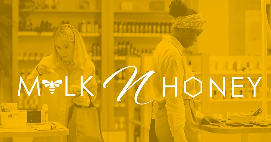 milk-n-honey-skincare-brand-banner Milk N Honey logo over a yellow-toned photo of two women shopping for skincare.