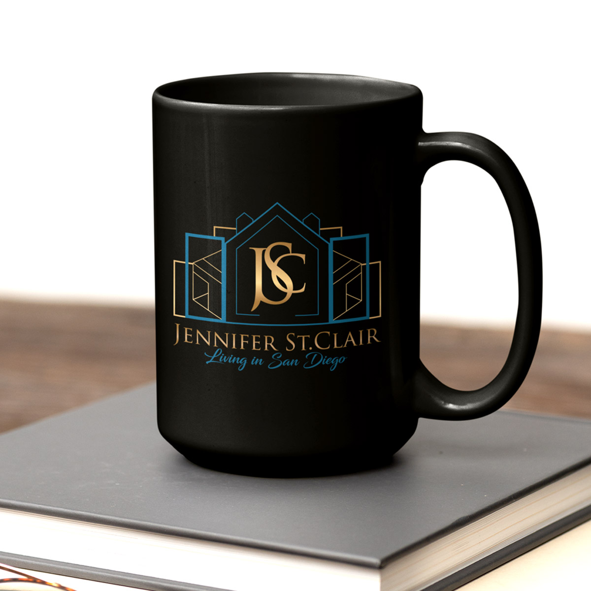 real-estate-agent-logo-mug Real estate agent logo printed on a black ceramic mug as a branded merchandise item