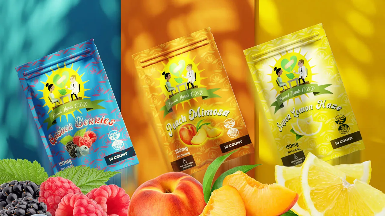 cbd-gummy-packaging-flavor-lineup Three gummy pouches in blue, orange, and yellow above fresh berries, peaches, and lemon slices.