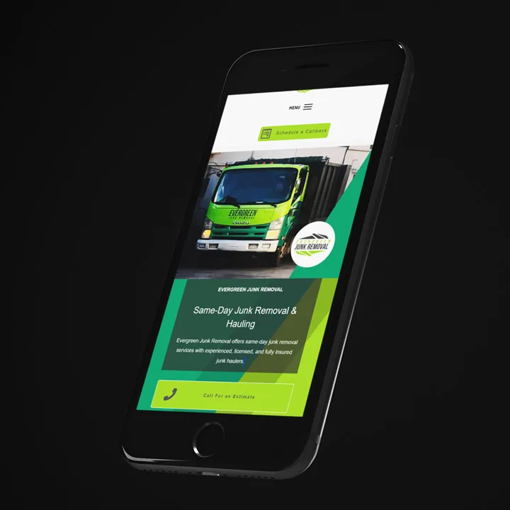 junk-removal-mobile-website-design-mockup Black smartphone angled on a dark background showing a green junk removal page, mobile website design.