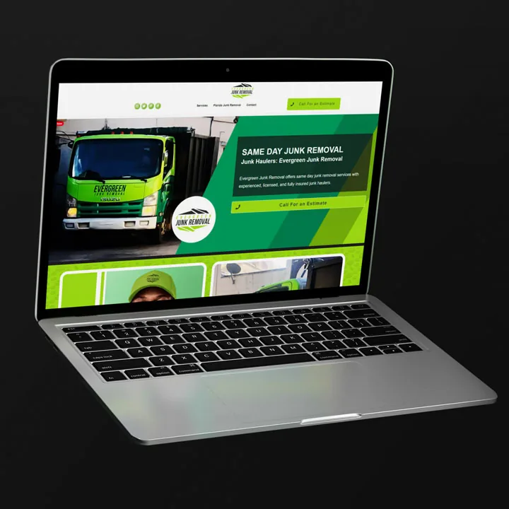 junk-removal-website-design-laptop-mockup Silver laptop on a black background displaying a green junk removal homepage, website design mockup.