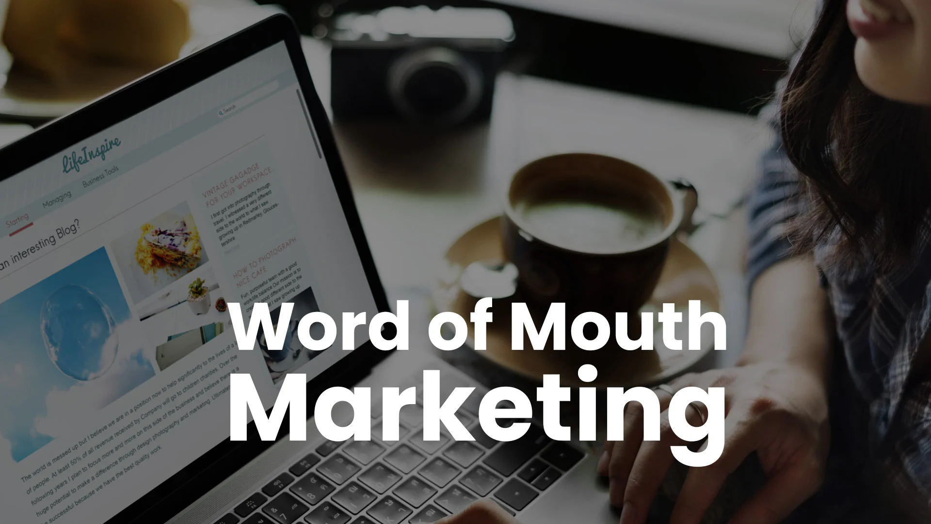 Word of Mouth Marketing A smiling woman types on a laptop showing a blog page, next to a cup of coffee, for word-of-mouth marketing.